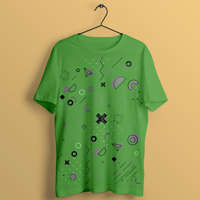 green shirt with abstract geometry logo on green color shirt. the shirt hang on yellow wall.